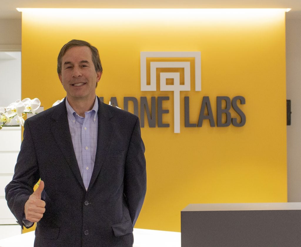 Stu Lipsitz in front of an Ariadne Labs sign