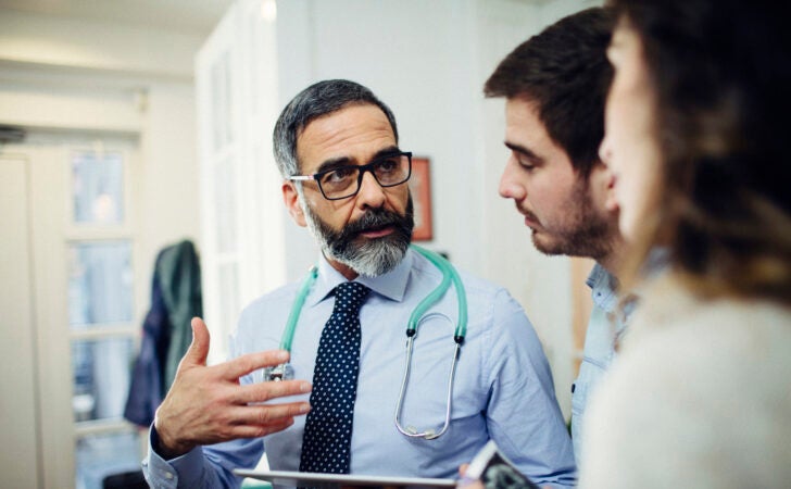 A couple consulting with their doctor.