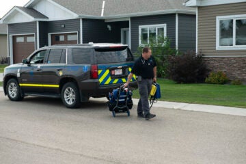 A medic arrives at patient's home to provide care