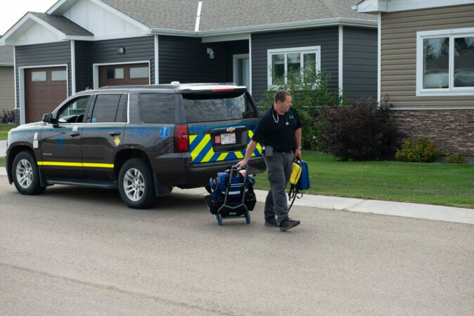 A medic arrives at patient's home to provide care